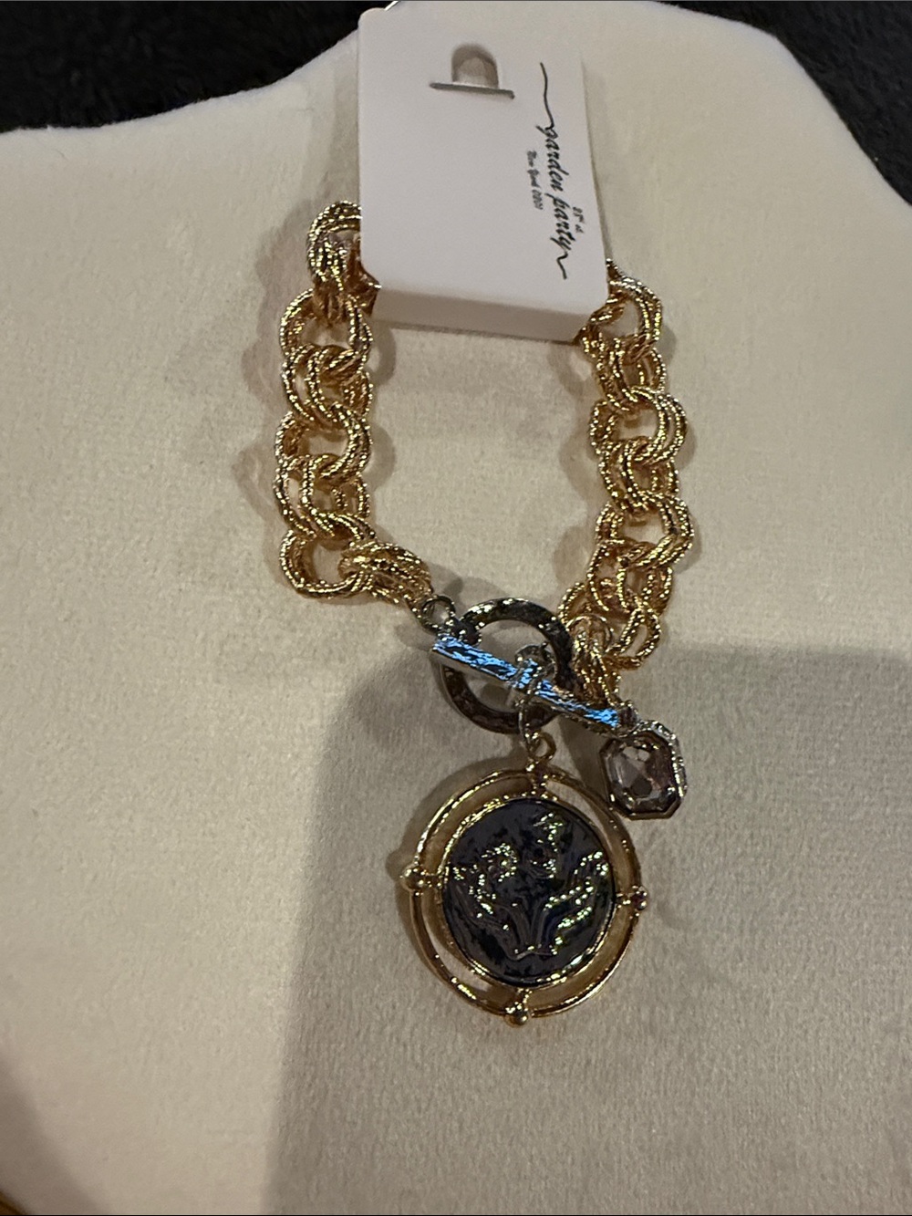 Gold-Tone Chain Bracelet with Black Medallion Charm